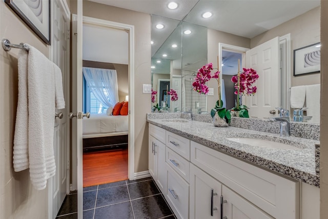 bathroom with vanity and tile patterned floors