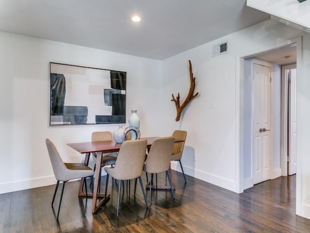 dining area featuring visible vents, baseboards, wood finished floors, and recessed lighting