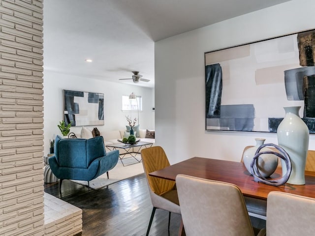 dining area featuring a ceiling fan and wood finished floors