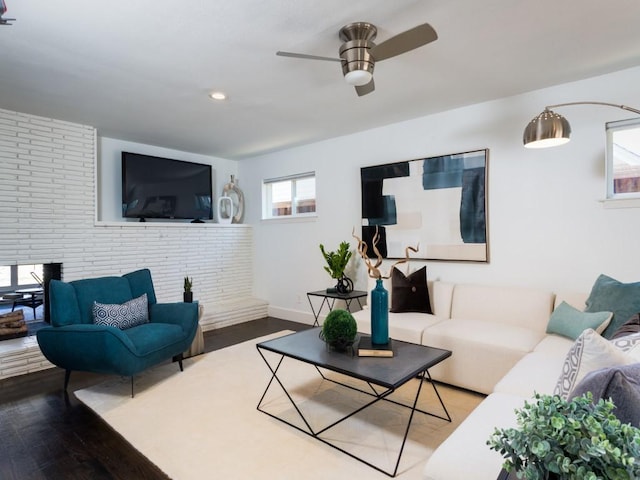 living room featuring recessed lighting, ceiling fan, baseboards, and wood finished floors