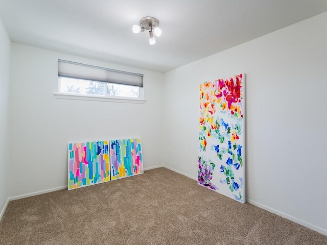 playroom featuring carpet floors and baseboards