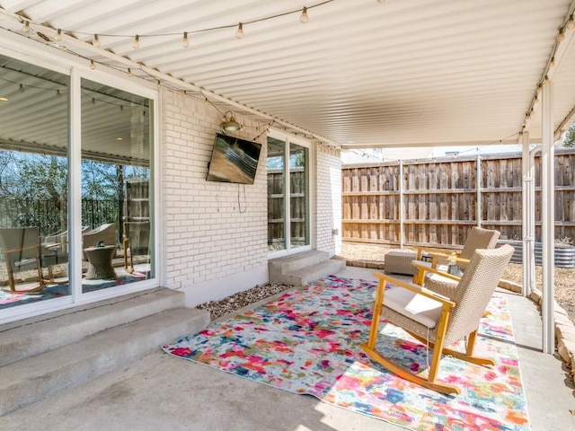 view of patio / terrace with fence