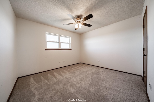 carpeted empty room featuring a textured ceiling and ceiling fan