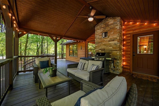 wooden deck with area for grilling, outdoor lounge area, and ceiling fan