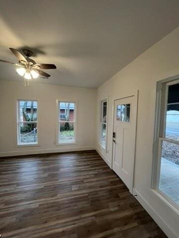 foyer with lofted ceiling, dark wood-type flooring, and ceiling fan