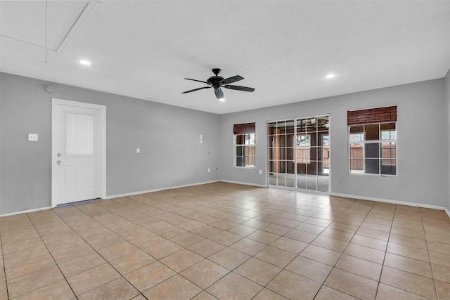 1308 Abbott Dr, Irving, TX 75060 - spare room with attic access, ceiling fan, recessed lighting, baseboards, and light tile patterned floors