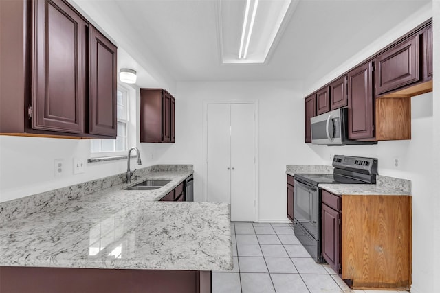 1308 Abbott Dr, Irving, TX 75060 - kitchen with appliances with stainless steel finishes, a sink, light tile patterned floors, light stone countertops, and a peninsula