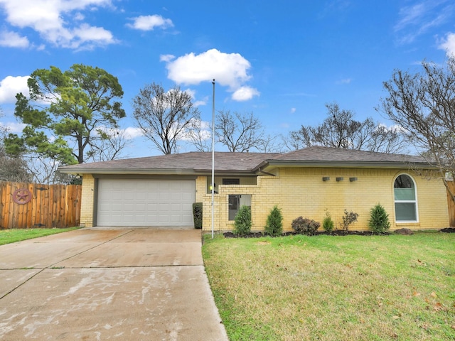 single story home with a garage and a front yard