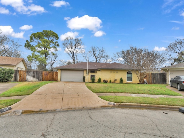 ranch-style home featuring a garage and a front yard