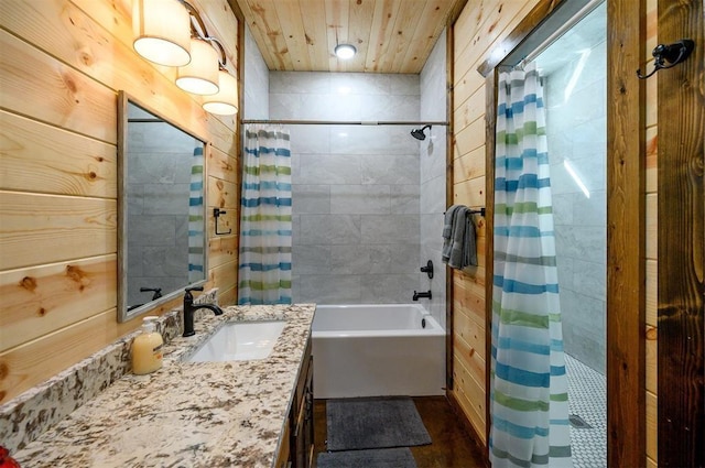 bathroom with shower / bath combination with curtain, vanity, wooden walls, and wooden ceiling