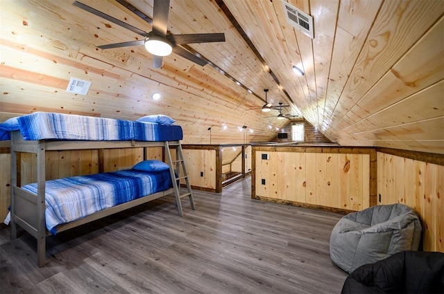 bedroom featuring wood ceiling, dark hardwood / wood-style flooring, vaulted ceiling, and wood walls