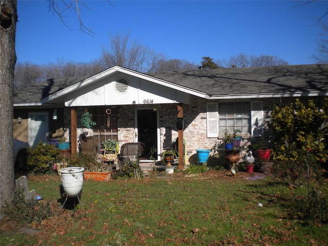 back of house with a lawn