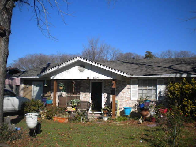 rear view of house with a lawn