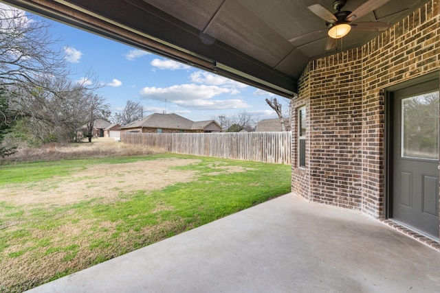 view of yard with a patio and ceiling fan