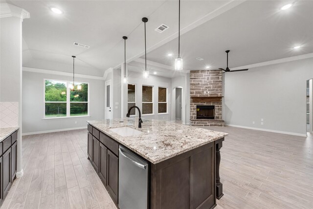 3915 Southern Oaks Dr, Royse City, TX 75189 - kitchen with ceiling fan, a sink, dishwasher, baseboards, and a stone fireplace