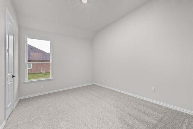3915 Southern Oaks Dr, Royse City, TX 75189 - spare room with vaulted ceiling, light colored carpet, and baseboards