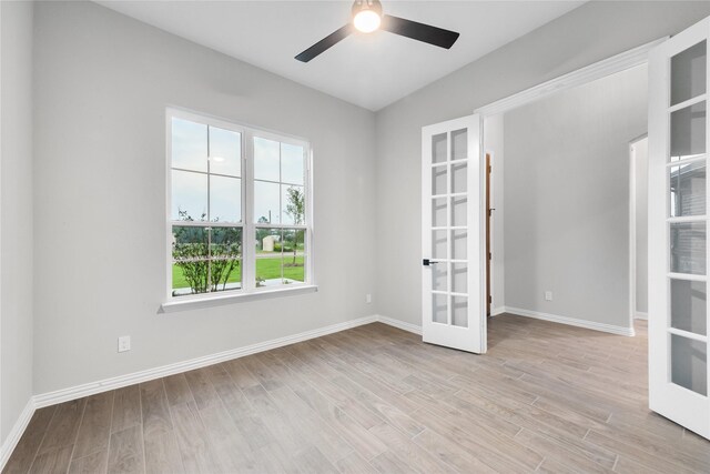 3915 Southern Oaks Dr, Royse City, TX 75189 - spare room featuring french doors, a ceiling fan, light wood-type flooring, and baseboards