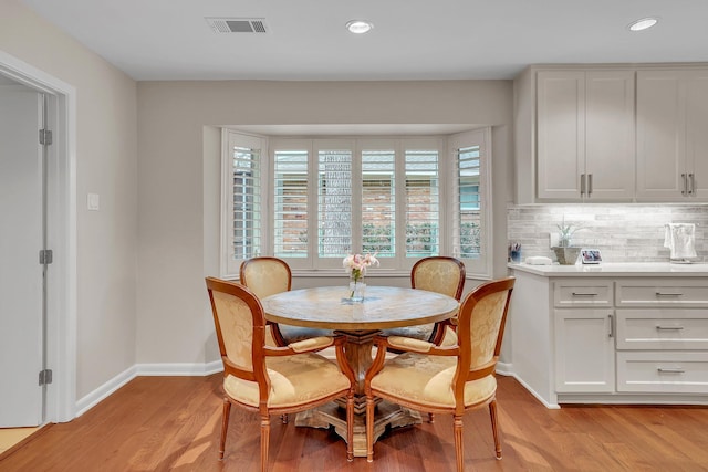 dining space featuring light hardwood / wood-style flooring