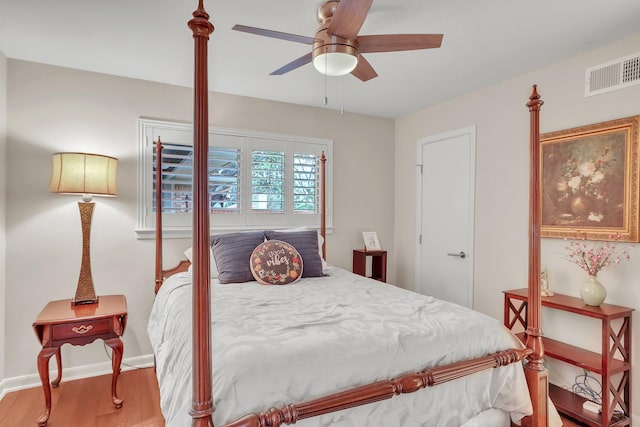 bedroom with hardwood / wood-style floors and ceiling fan