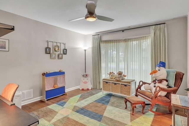 interior space with hardwood / wood-style flooring and ceiling fan