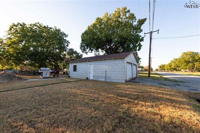 garage with a yard