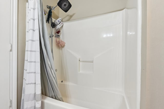 bathroom featuring shower / bath combination with curtain