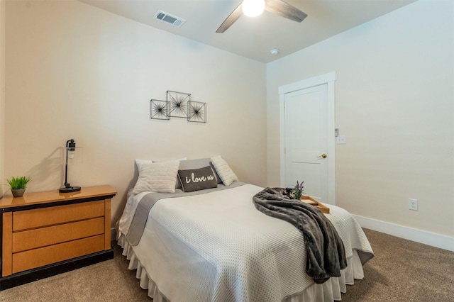 bedroom with visible vents, carpet floors, baseboards, and a ceiling fan