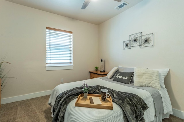 carpeted bedroom featuring visible vents, a ceiling fan, and baseboards