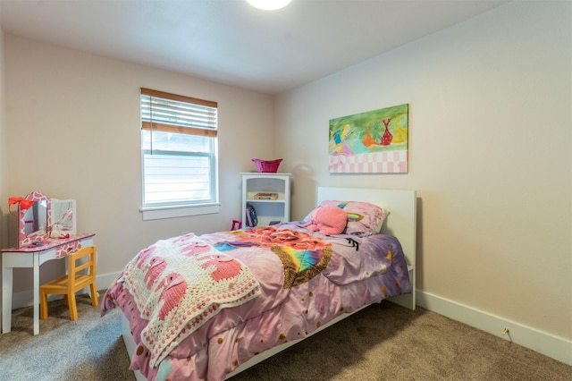 bedroom with baseboards and carpet