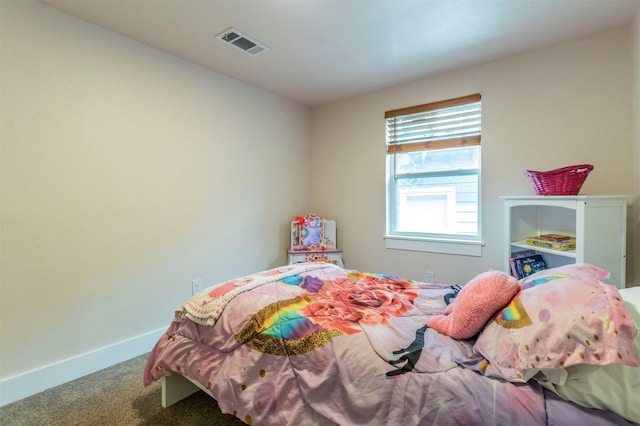 bedroom with visible vents, baseboards, and carpet