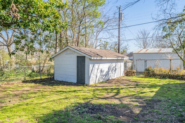 view of shed with a fenced backyard