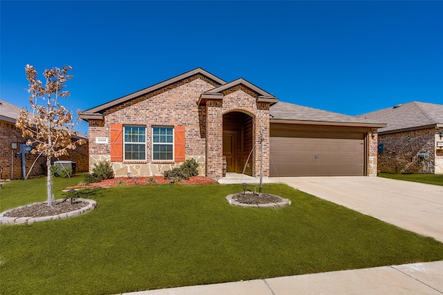 ranch-style house featuring a garage, a front yard, brick siding, and driveway