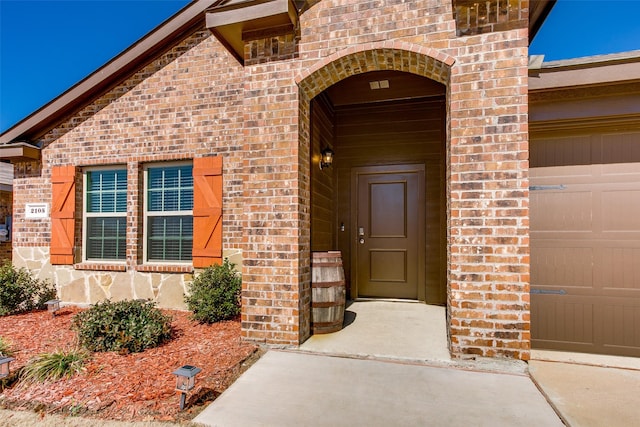 entrance to property with brick siding