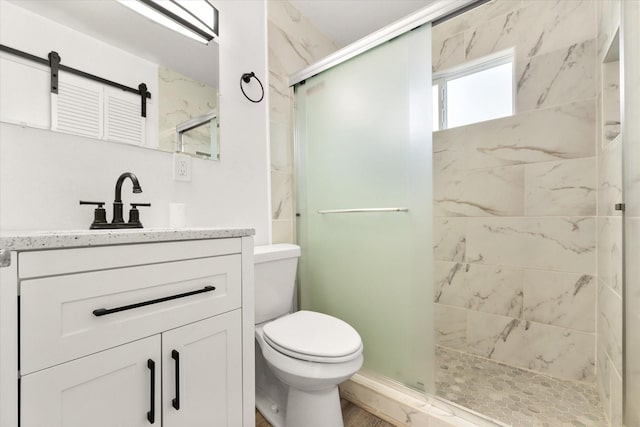 2717 Eagle Dr, Dallas, TX 75216 - bathroom with a shower with door, vanity, and toilet