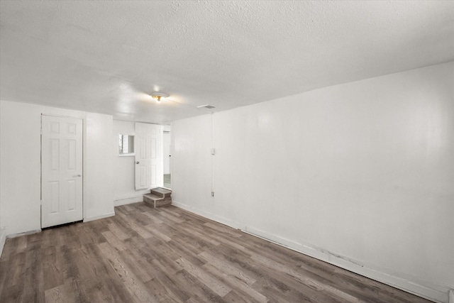 2717 Eagle Dr, Dallas, TX 75216 - spare room with hardwood / wood-style floors and a textured ceiling
