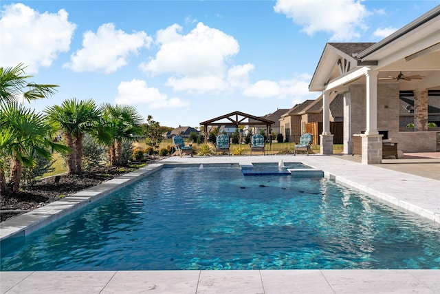 pool with a gazebo, a patio, an in ground hot tub, and ceiling fan