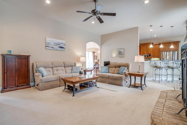 living room with light carpet and ceiling fan