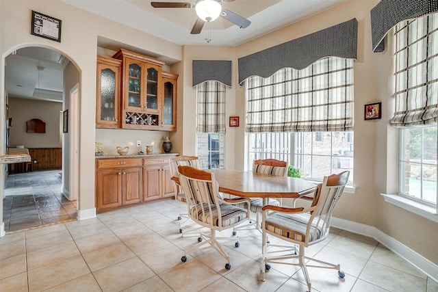 dining area featuring light tile patterned flooring and ceiling fan