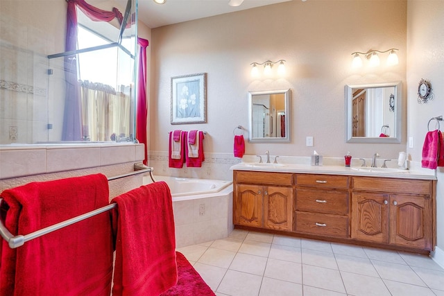 bathroom with vanity, tile patterned floors, and shower with separate bathtub