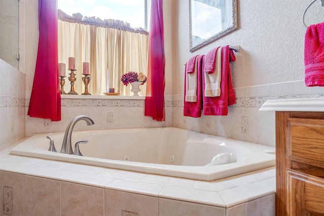 bathroom featuring tiled tub