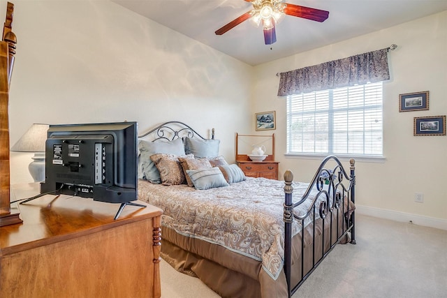 bedroom featuring ceiling fan and light colored carpet