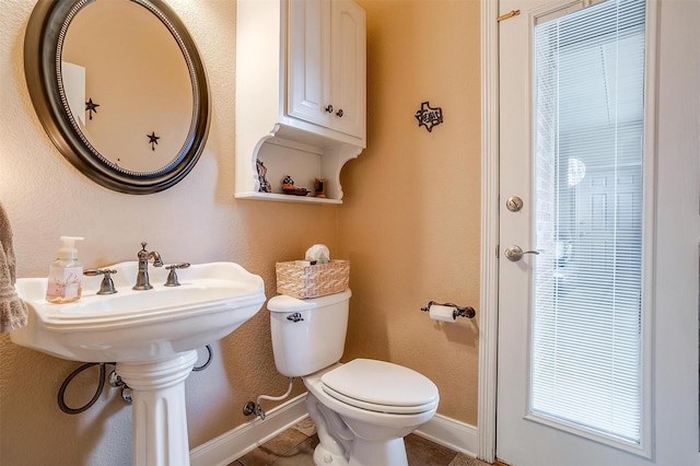 bathroom featuring tile patterned floors and toilet