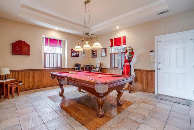 rec room with billiards, wooden walls, a tray ceiling, ornamental molding, and light tile patterned flooring