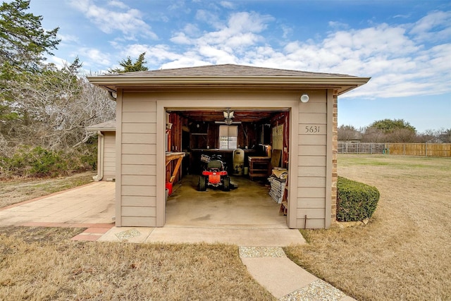 view of outbuilding featuring a yard and a garage