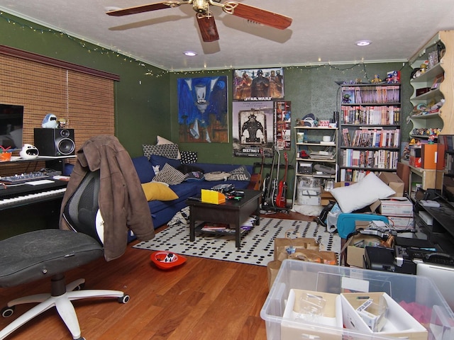 home office featuring hardwood / wood-style floors and ceiling fan