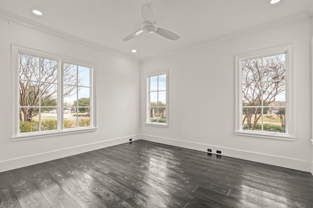 unfurnished room featuring ornamental molding, dark wood-type flooring, a wealth of natural light, and ceiling fan