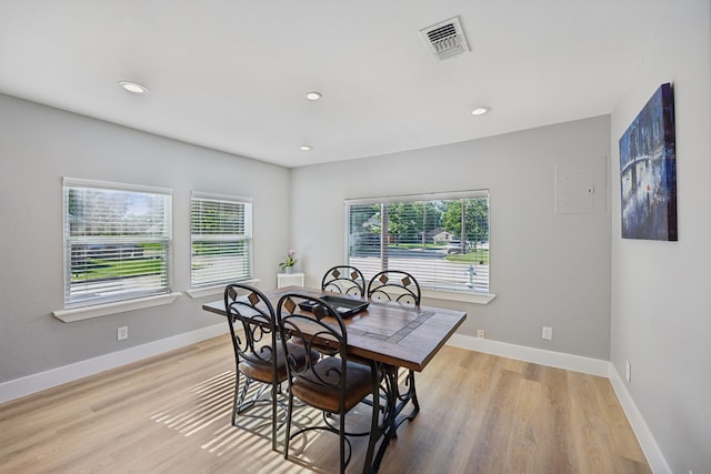 dining area featuring light wood-type flooring