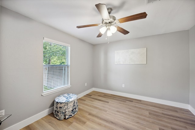 unfurnished room featuring ceiling fan and light hardwood / wood-style floors