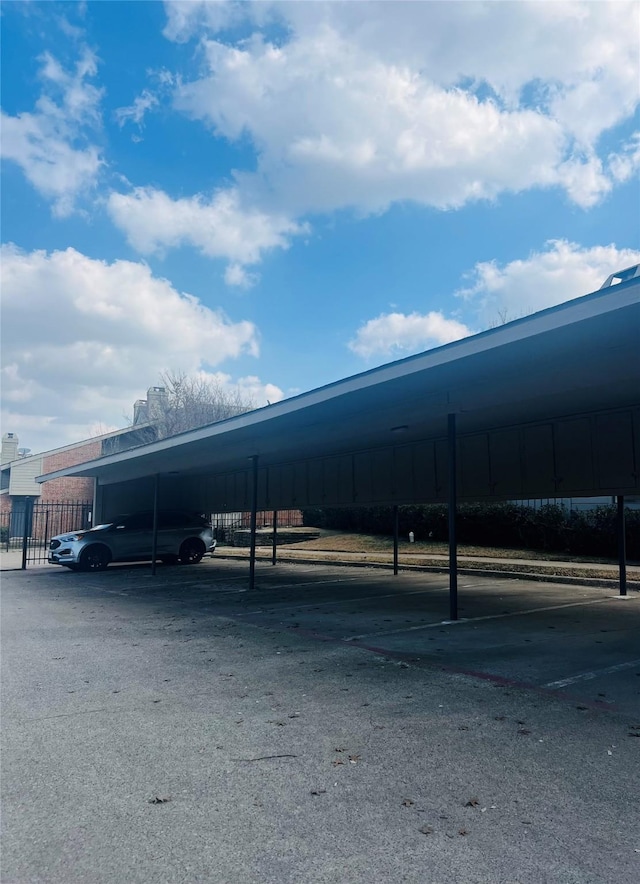 view of vehicle parking featuring a carport