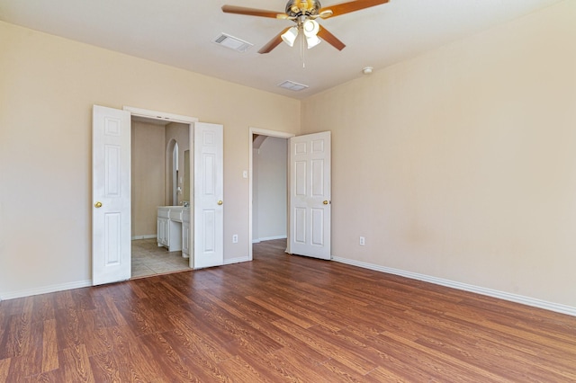 unfurnished bedroom featuring hardwood / wood-style flooring